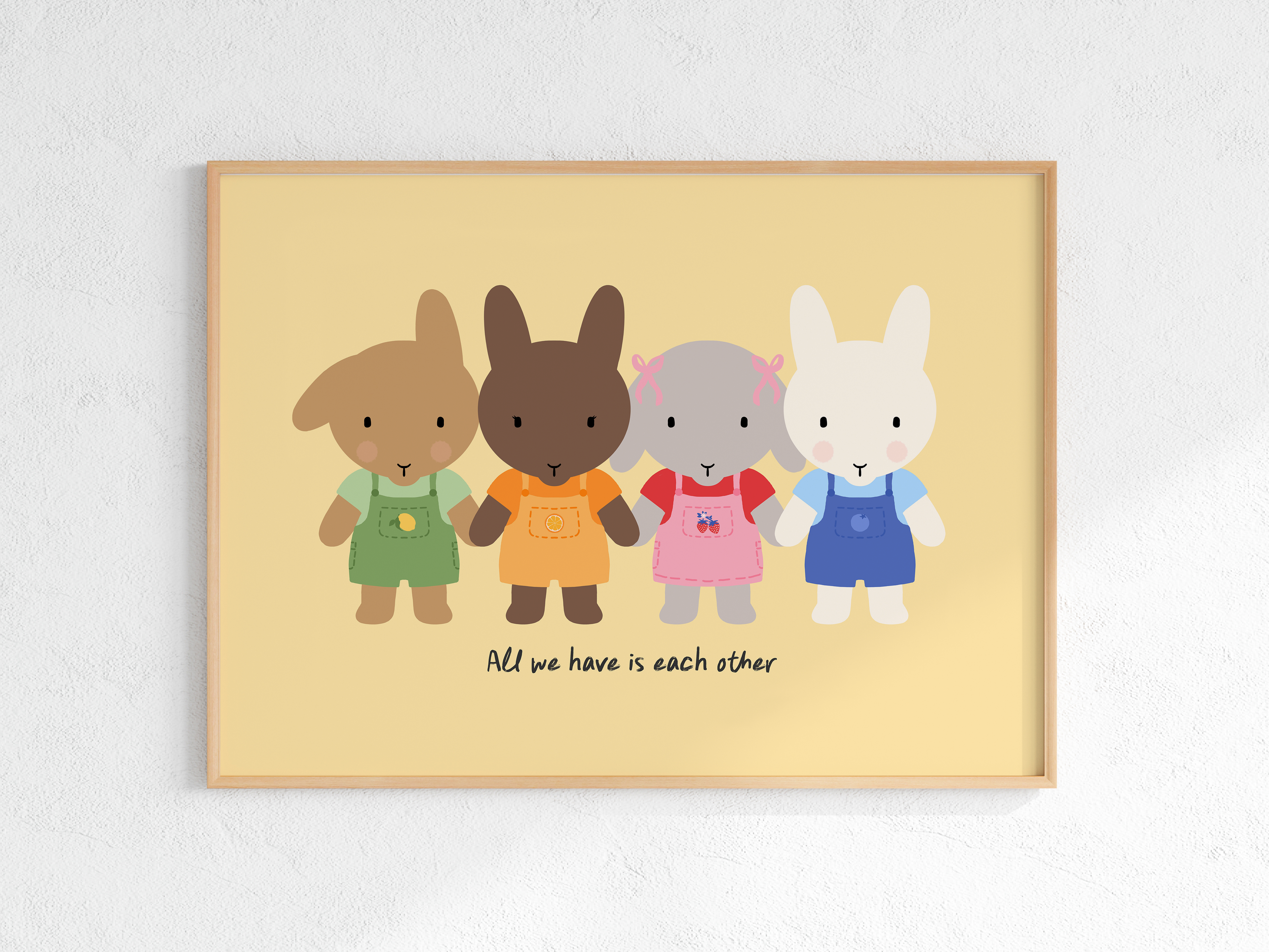 Claude, Luna, Winnie and Clem the buns are dressed in overalls with their corresponding colors (green, orange, pink and blue in order).