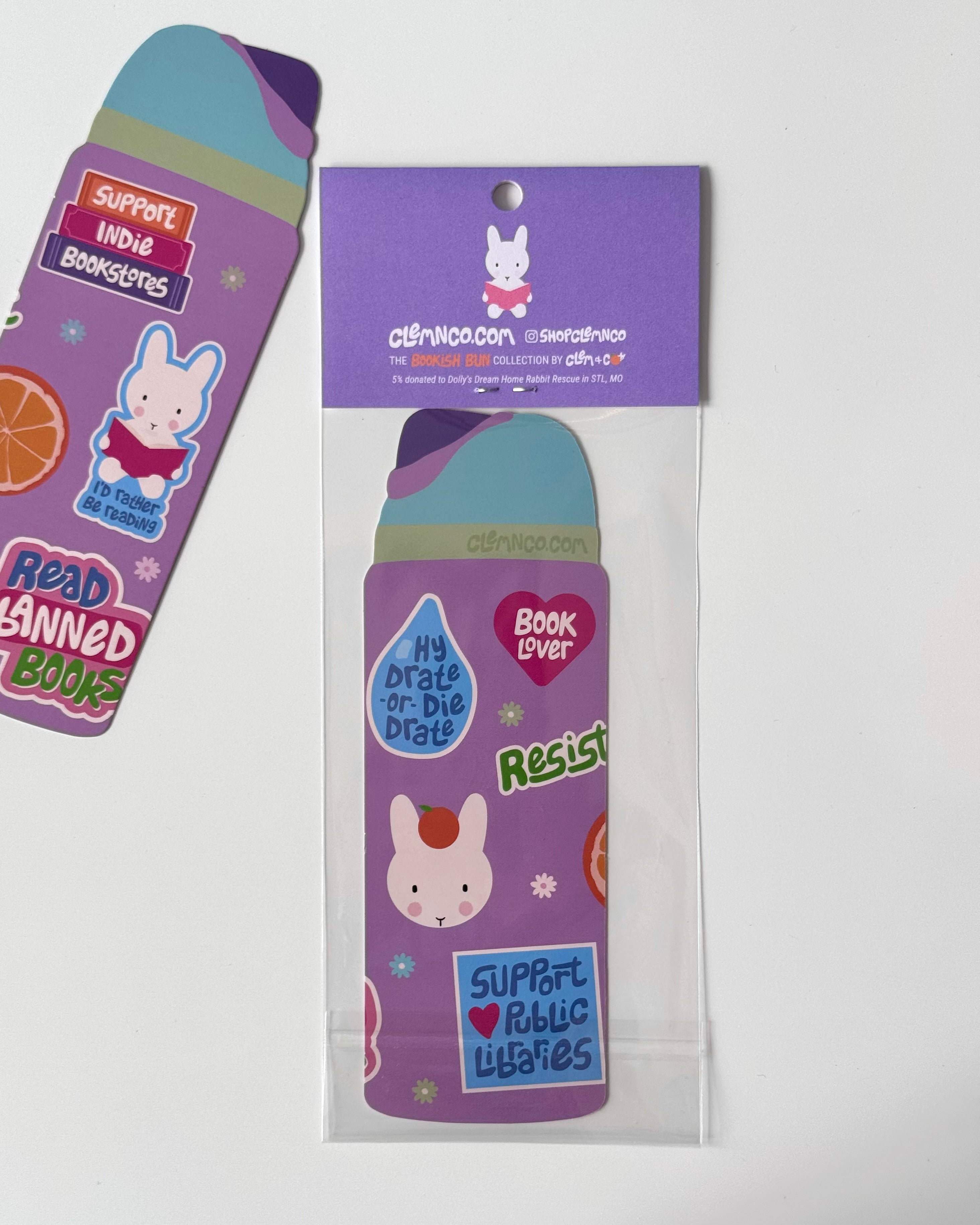 Illustrated purple water bottle shaped bookmark with bookish themed stickers with packaging.