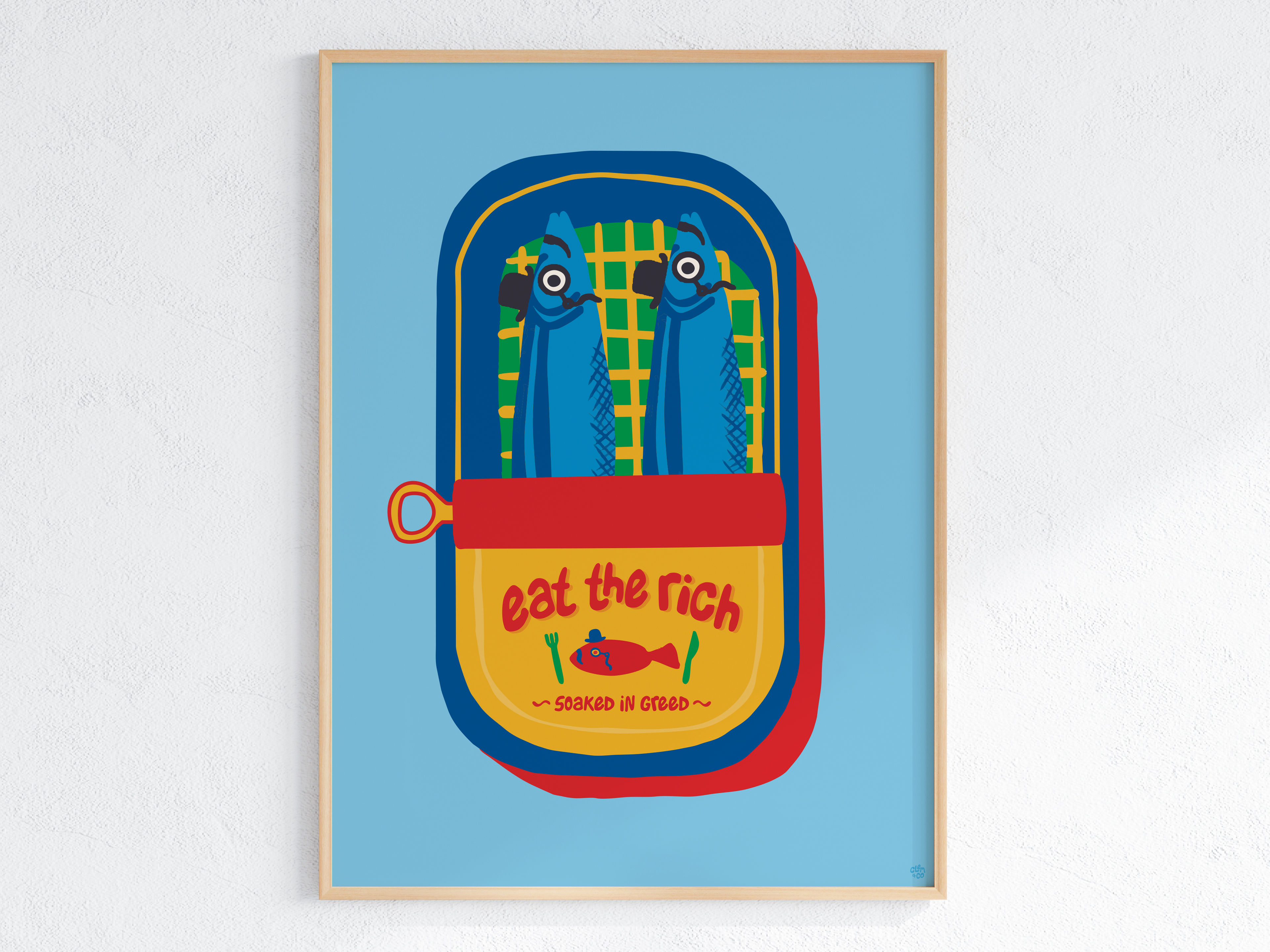 A sardine tin saying "Eat the rich" and "Soaked in Greed". The two fish in the tin are wearing monocles and top hats. 